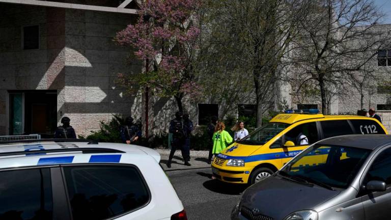 Portuguese emergency services stand in front of the Ismaili Islamic centre in Lisbon, after two people died following a knife attack that wounded several others, on March 28, 2023. AFPPIX